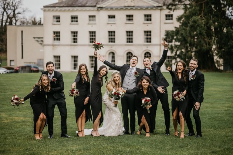 Wedding photo of Bride, Groom and their very happy bestmen and bridesmaids, taken by Darren Byrne Photography