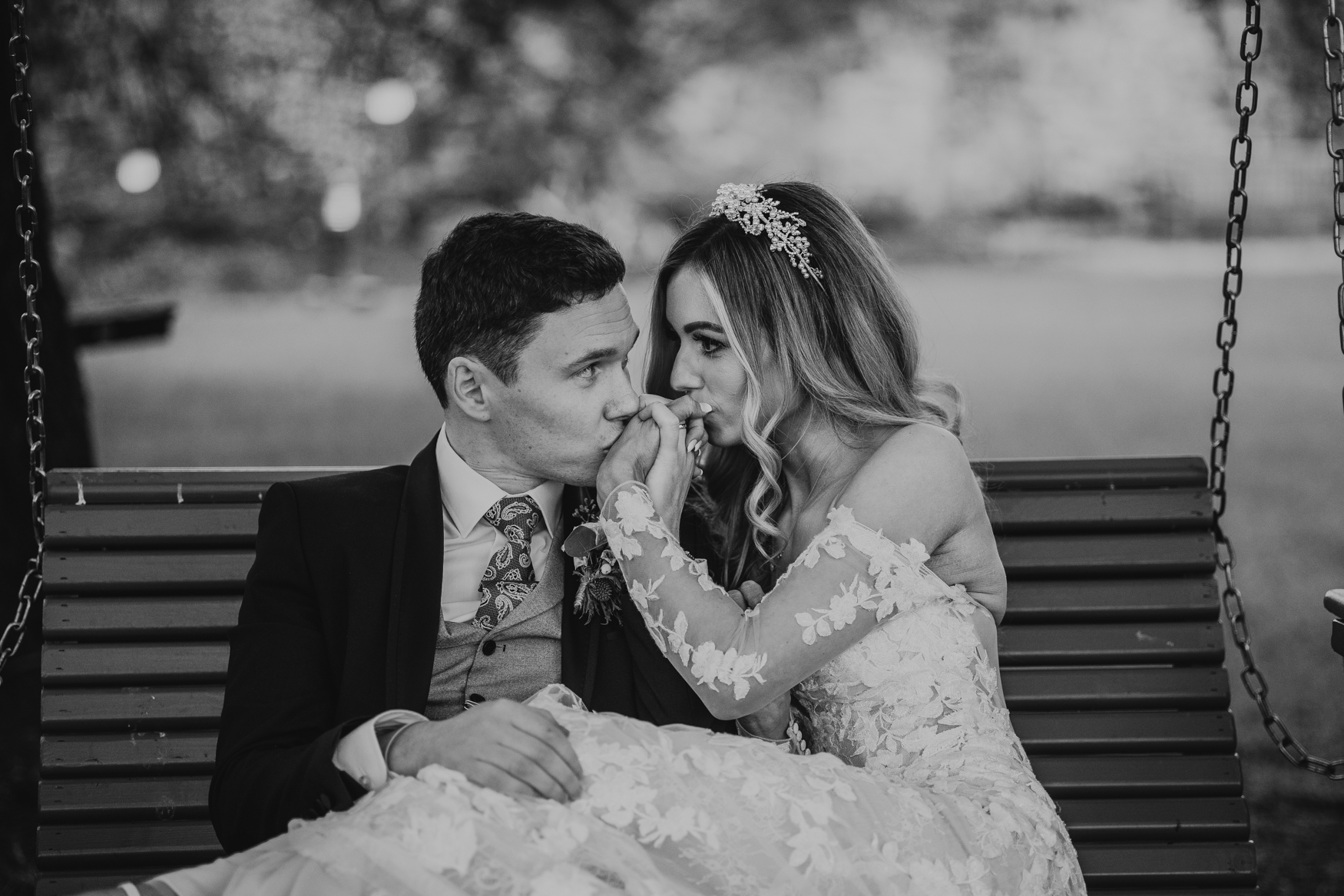 Bride and groom sharing a quiet moment on a garden bench – captured by Darren Byrne, Wedding Photographer Ireland.