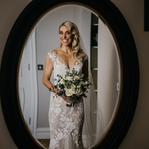 Bride holding a small, elegant wedding bouquet, perfectly sized for comfort and style – captured by Darren Byrne, Wedding Photographer in Ireland.