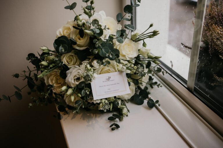 Wedding bouquet of flowers placed elegantly on a windowsill – captured by Darren Byrne, Wedding Photographer in Ireland.