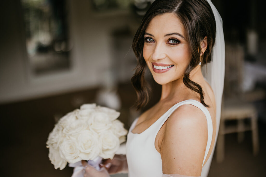 Bride glances back as she is about to leave for the church.
